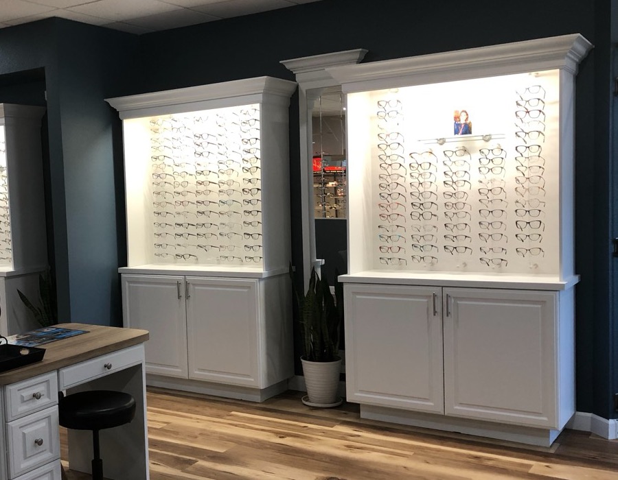 Lit display cases at the Walesby optical, each frame individually visible